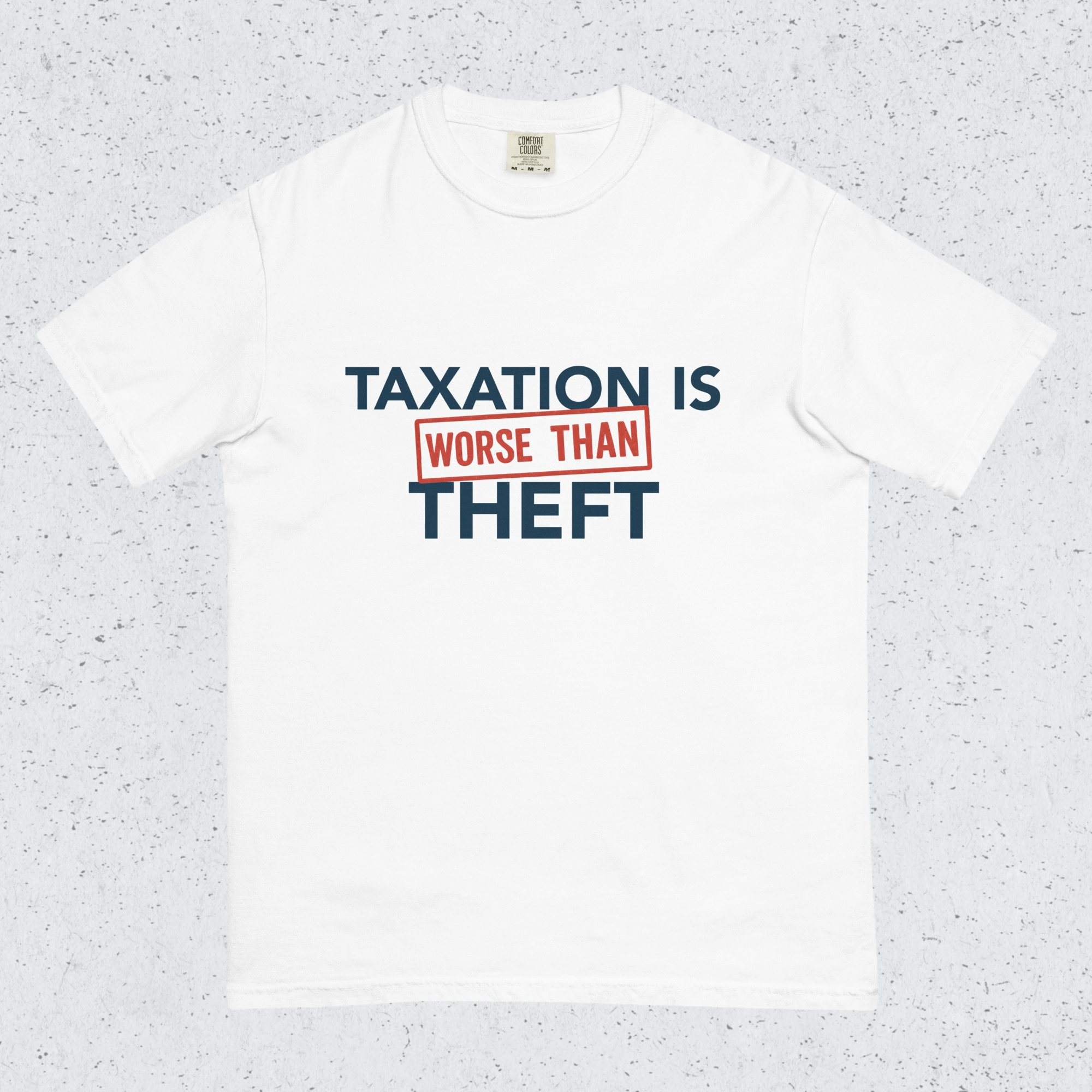 White t-shirt with 'Taxation is Worse than Theft' text on a speckled gray background